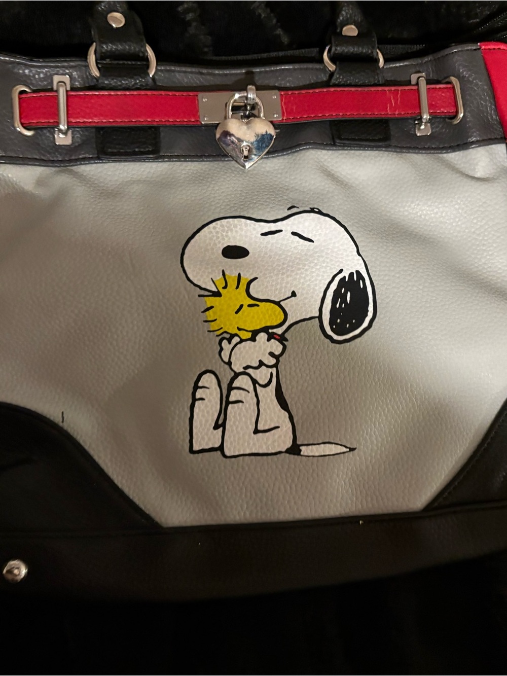 The Bradford Exchange White and Black Duffel Bag with Red Trim featuring Snoopy